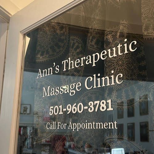 Ann's Therapeutic Massage Clinic door sign with phone number on Progress Way in Bryant, Arkansas