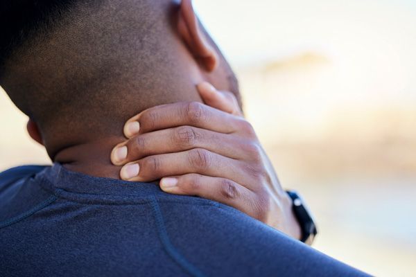 Man with neck pain looking for massage therapy relief in Bryant, AR